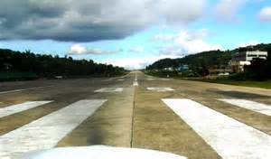What effect does an uphill runway slope have on takeoff performance?